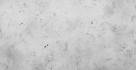 Gray backdrop with blur effect, picture of gray concrete wall with black dots on surface.