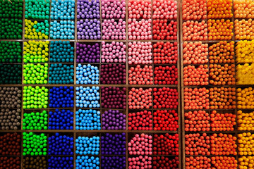 assortment of colorful pen stored in rack