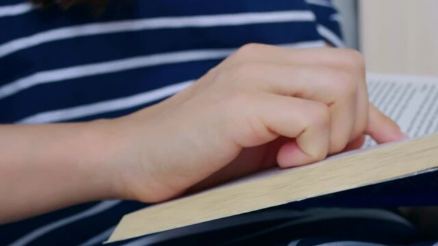 Read an open book. While reading, the finger is led along the lines in the book. Reading books helps to think and think, develops imagination and imagination. Homeschooling.