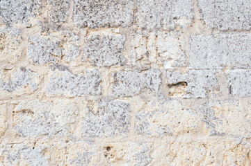 Textured background stone wall of a medieval castle