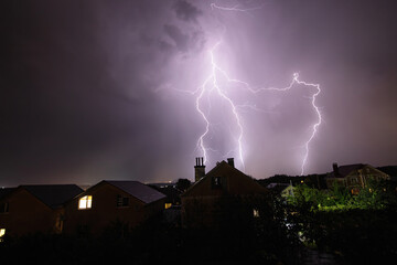 Beautiful lightning flashes in the evening sky during a thunderstorm