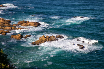 Waves crashing on rocks in the ocean