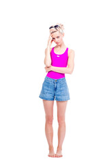 Vertical full length studio portrait of young Caucasian woman wearing summer outfit having stress headache, white background