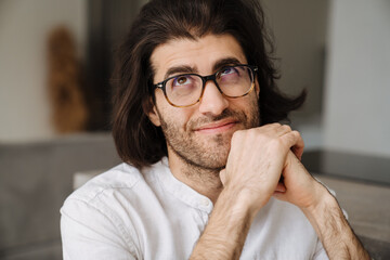 Close up of a smiling mid aged brunette turkish man