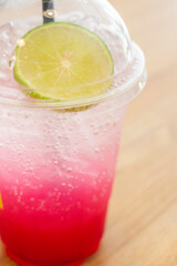 Refreshing soda water with lime in glass