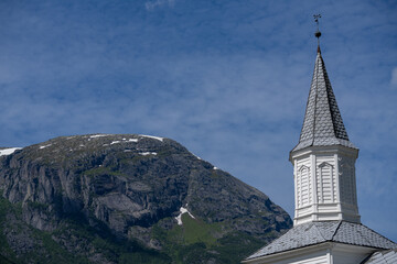 Odda Kirke (Odda Church) with the mountain Lauvhoggen in the background.
