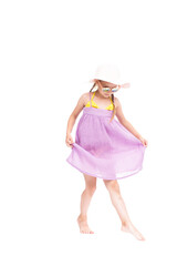Vertical full length studio portrait of cute Caucasian girl wearing summer dress, sunglasses and...