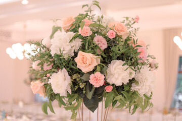 Luxurious floral bouquet for wedding presidium, made in delicate pink and cream tones with textured greenery. Wedding events. Floristry and design. Pink color.