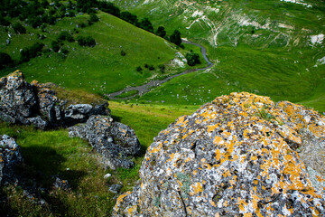Beautiful green landscapes with hills, forest and rocks in Moldova. Eco tourism without people.