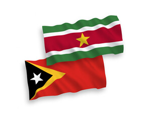 Flags of Republic of Suriname and East Timor on a white background