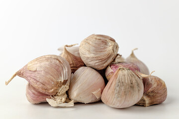 raw garlic on a white background