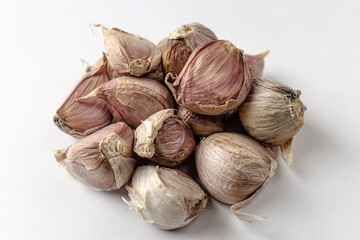 raw garlic on a white background