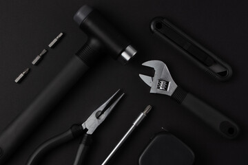 Black tools on black background