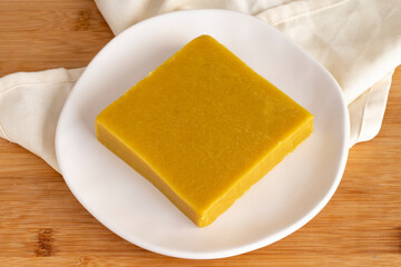 Almond halva. Halva on wooden background. Turkish halvah for Breakfast. Local name badem helvası