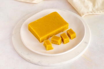 Almond halva. Halva on wooden background. Turkish halvah for Breakfast. Local name badem helvası