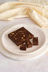 Walnut halva. Halva on wooden background. Turkish halvah for Turkish Breakfast. Local name cevizli helva