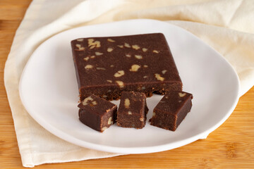 Walnut halva. Halva on wooden background. Turkish halvah for Turkish Breakfast. Local name cevizli helva