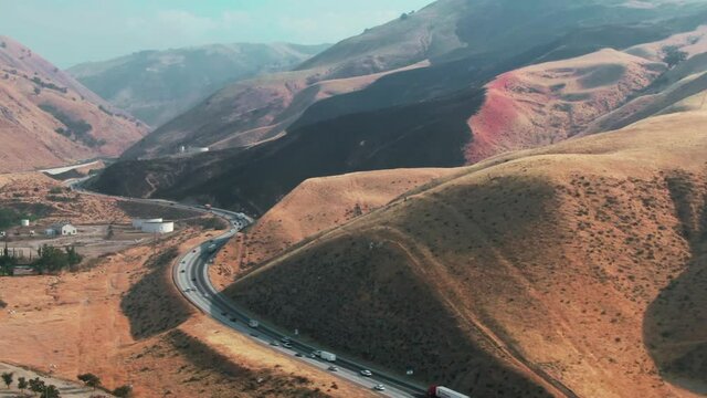 Aerial: Traffic on the Interstate 5 in Grapevine that flows into Los Angeles, California, USA, California, USA