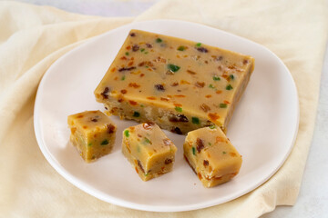 Fruit halva. Halva on wooden background. Turkish halvah for Turkish Breakfast. Local name meyveli yaz helvası