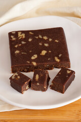 Walnut halva. Halva on wooden background. Turkish halvah for Turkish Breakfast. Local name cevizli helva