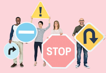 Happy diverse people holding road signs