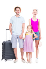 Vertical full length studio portrait of family with one child wearing summer outfits ready to travel on vacation, white background