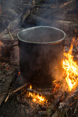 preparing food on a campfire