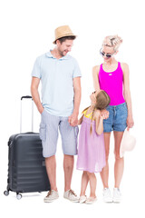 Vertical full length studio portrait of family with one child wearing summer outfits ready to travel on vacation, white background