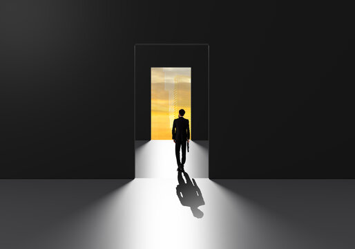 Businessman walking through success door