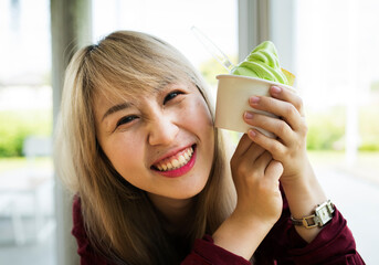 Woman eating melon ice-cream happiness