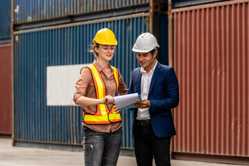 Container Depot chief talking to female foreman about custom goods packing list documents