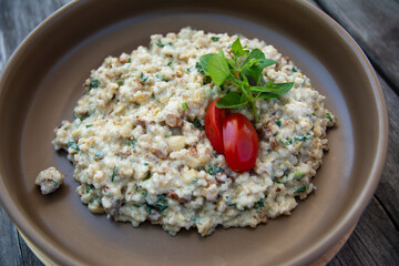 pearl barley meal with red tomato and basil.