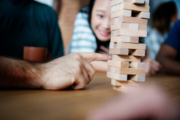 Friends playing game together at home