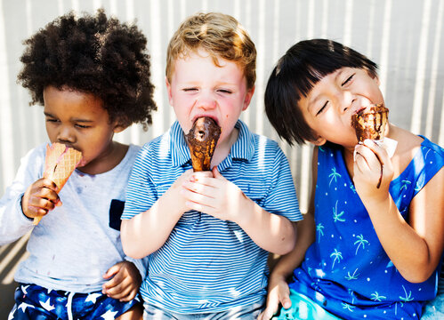 Children enjoying ice cream on a summer day