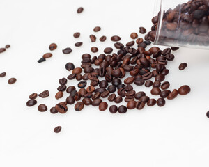 Coffee beans on a bright white background. This is an arabica coffee bean. The distinctive taste of Arabica coffee is in the form of a light consistency and a higher acidity level than other coffees.