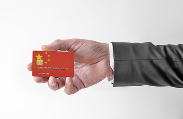 Bank credit plastic card with flag of China holding man in elegant suit