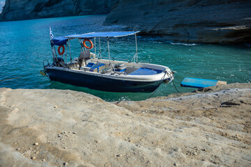 boat anchored in stunning turquoise water