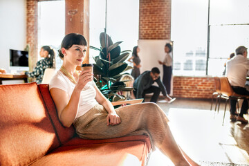 Business woman having a coffee in the cafe