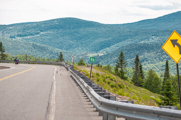 Fototapeta na wymiar Motorcyclist on mountain road