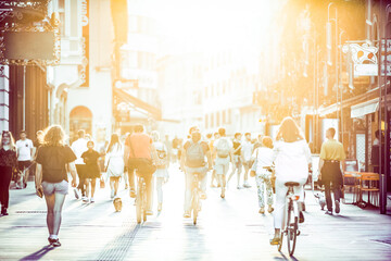 Blurred crowd of people on Copova pedestrian street in Ljubljana at sunset. Urban lifestyle and...