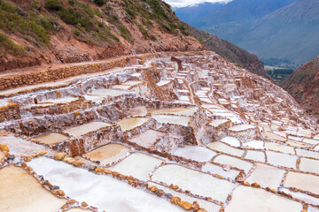 Naklejka premium View of the natural salt pools in Las Salineras de Maras in the Sacred Valley of Cusco