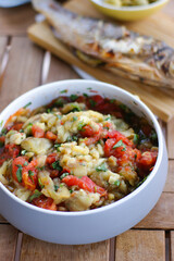 Spicy salad with eggplant and grilled tomatoes.