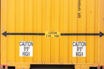 yellow container with wide and heght signs