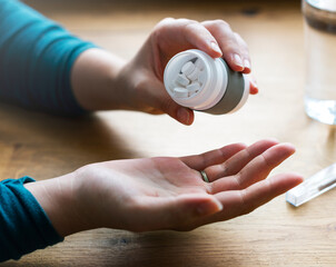 Woman taking her medication