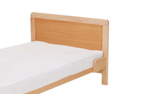 Wooden junior bed on a white isolated background
