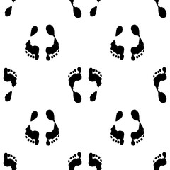 Vector seamless pattern of human footprints. a pattern of black silhouette of feet geometrically arranged on a white background for a design template