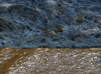 very dirty river flow close-up