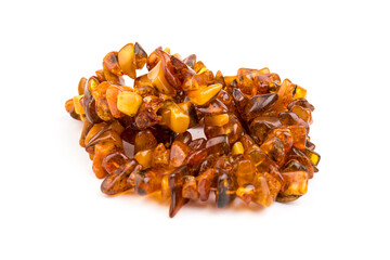Baltic necklace made of Natural polished transparent honey luxury amber beads with inclusions on white. close up selective soft focus. Space for text