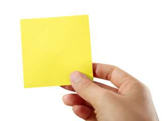 Obraz premium Hand holding a yellow sticky note isolated on white with clipping path