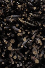 logs firewood stacked background wood chips cut trees